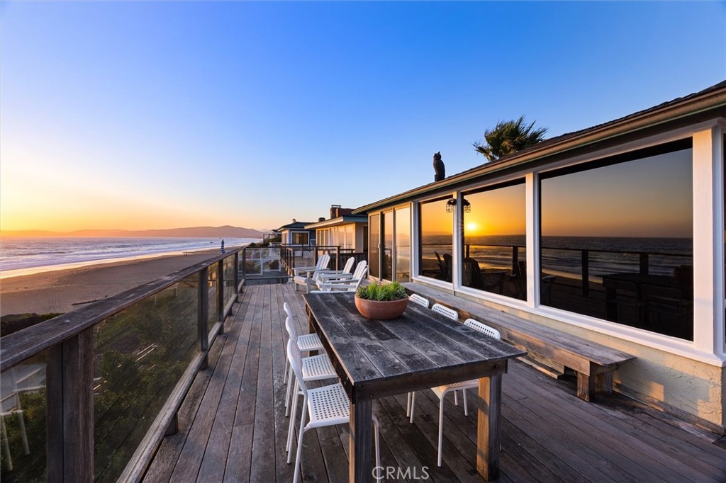 3448 Studio Drive Cayucos, CA 93430 - Photo 1 of 47 a view of a balcony with mountain view and wooden floor