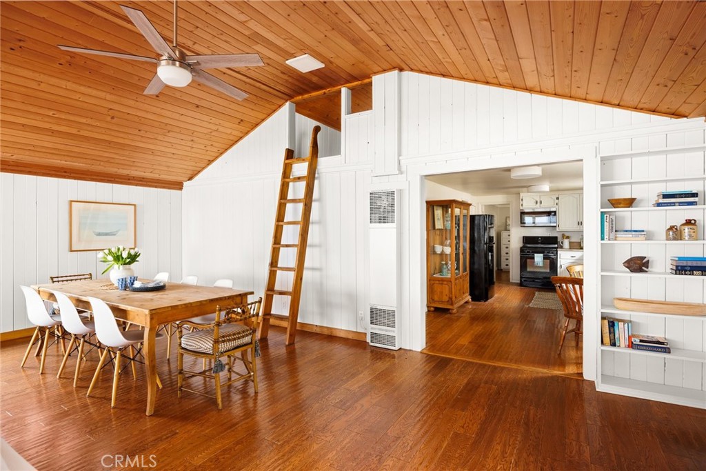 3448 Studio Drive Cayucos, CA 93430 - Photo 14 of 47 a dining room with furniture and wooden floor