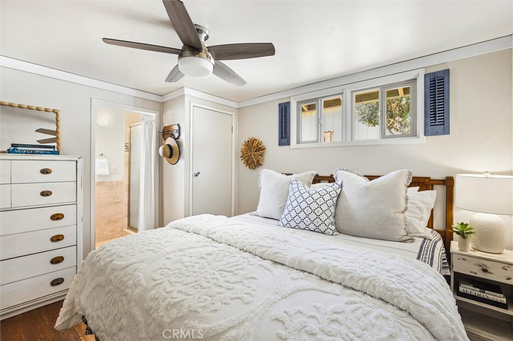 3448 Studio Drive Cayucos, CA 93430 - Photo 23 of 47 a large bed sitting in a bedroom next to a window with a tv