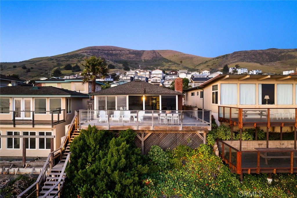 3448 Studio Drive Cayucos, CA 93430 - Photo 3 of 47 an aerial view of a house with a garden and lake view