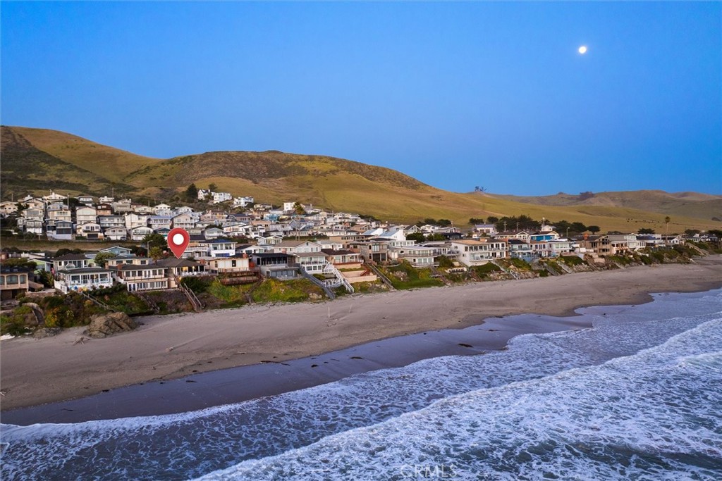 3448 Studio Drive Cayucos, CA 93430 - Photo 42 of 47 a view of a city with mountains in the background