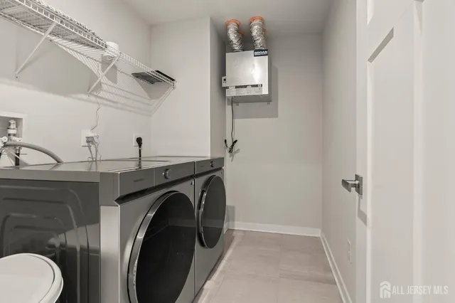 a view of a storage & utility room with washer and dryer