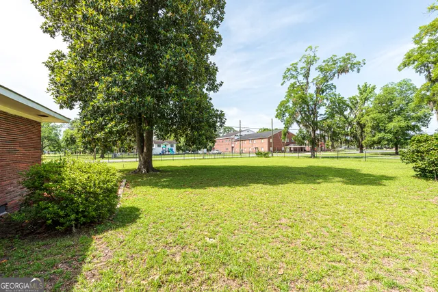 a view of a dining room with furniture and window