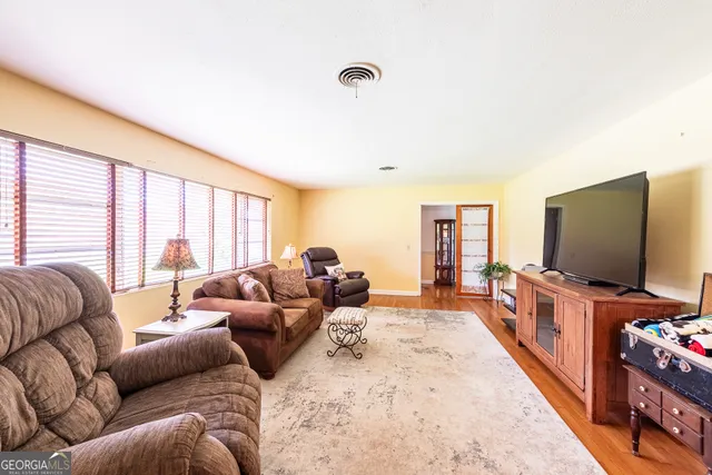a bathroom with a sink toilet vanity and a mirror