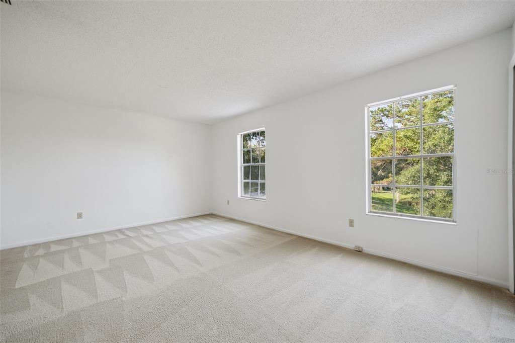 498 Green Spring Circle Winter Springs, FL 32708 - Photo 12 of 20 an empty room with windows