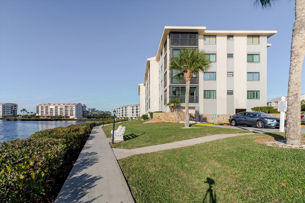8211 Brent Street, Unit 828 Port Richey, FL 34668 - Photo 23 of 75 a view of a house with backyard and sitting area