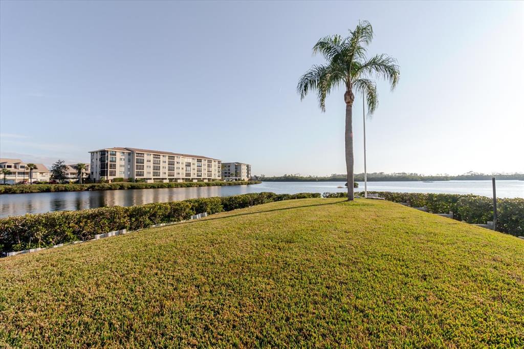 8211 Brent Street, Unit 828 Port Richey, FL 34668 - Photo 24 of 75 a view of swimming pool with outdoor seating and lake