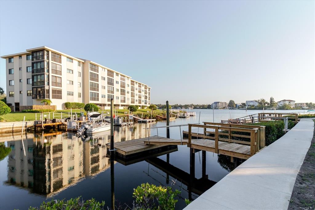 8211 Brent Street, Unit 828 Port Richey, FL 34668 - Photo 30 of 75 a view of a chairs and table in the terrace