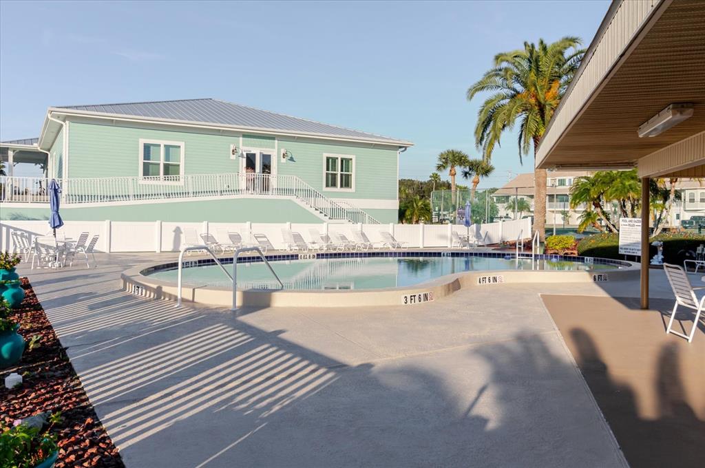 8211 Brent Street, Unit 828 Port Richey, FL 34668 - Photo 33 of 75 a swimming pool view with a outdoor seating