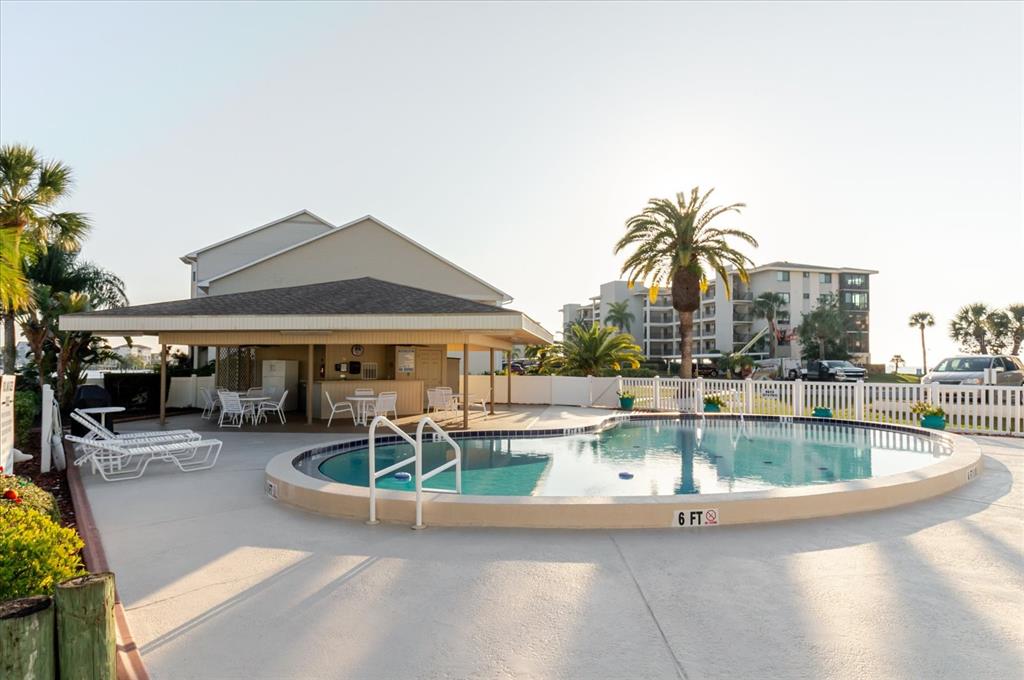 8211 Brent Street, Unit 828 Port Richey, FL 34668 - Photo 35 of 75 a view of a swimming pool with outdoor seating