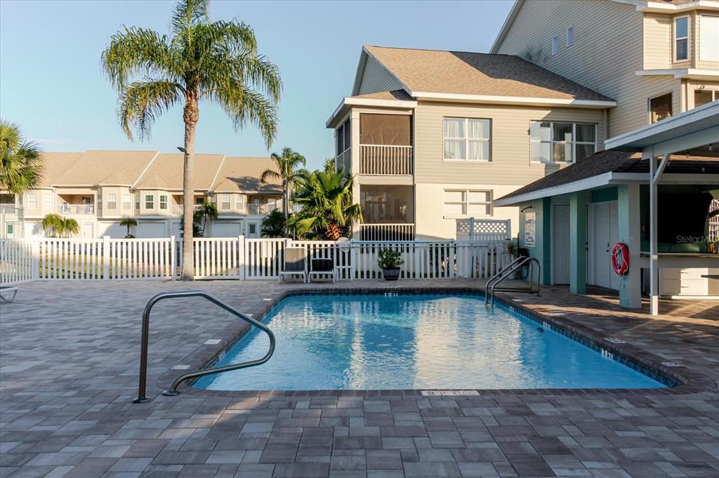 8211 Brent Street, Unit 828 Port Richey, FL 34668 - Photo 37 of 75 a view of a house with swimming pool and sitting area