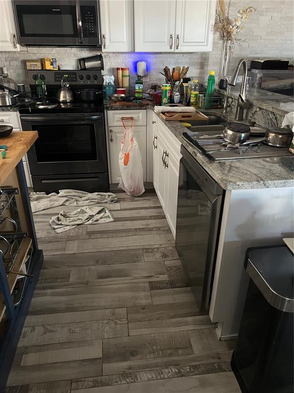 8211 Brent Street, Unit 828 Port Richey, FL 34668 - Photo 4 of 75 a kitchen with granite countertop a stove and a sink