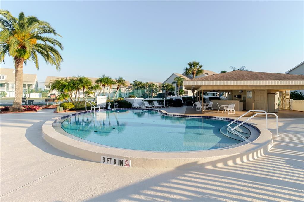 8211 Brent Street, Unit 828 Port Richey, FL 34668 - Photo 5 of 75 a view of a house with swimming pool and a sitting area