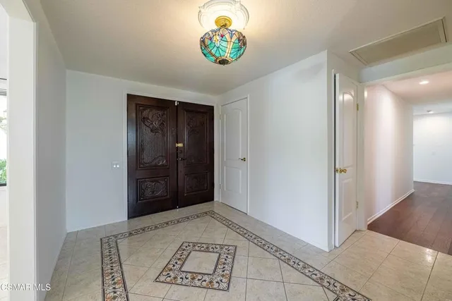 a view of a hallway to a bedroom