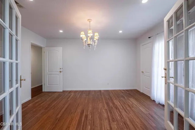 a view of livingroom with hardwood floor and hallway