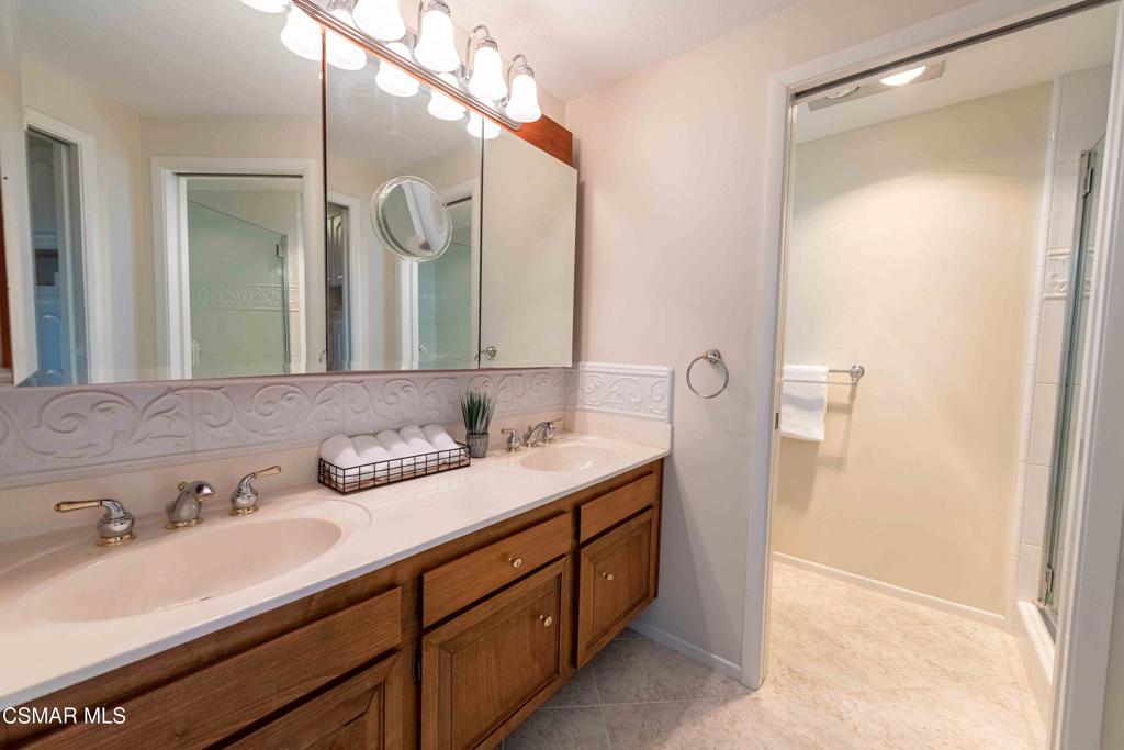 1319 Wilder Street Thousand Oaks, CA 91362 - Photo 27 of 31 a bathroom with a double vanity sink and mirror