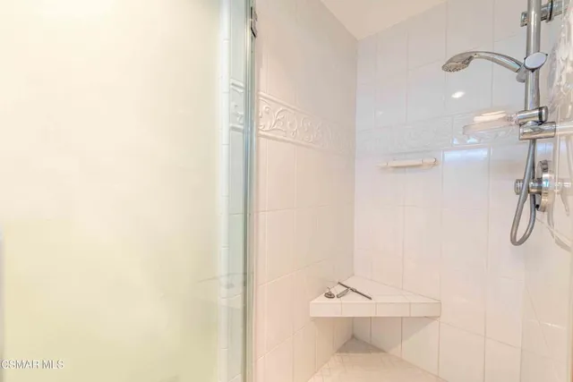 a bathroom with a shower and a toilet