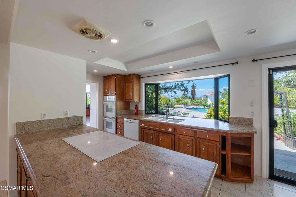 1319 Wilder Street Thousand Oaks, CA 91362 - Photo 10 of 31 a large kitchen with kitchen island a sink stainless steel appliances and cabinets