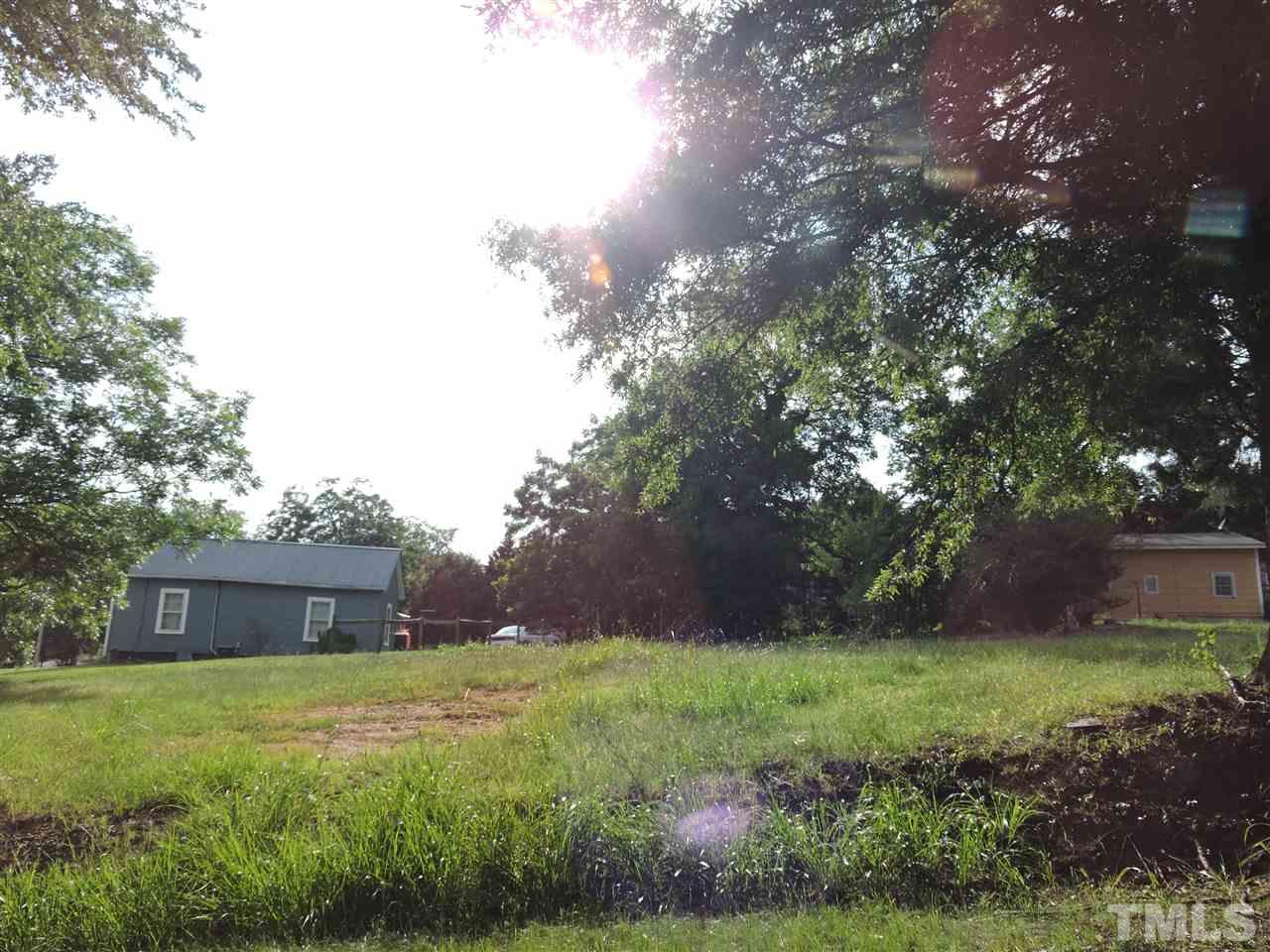 113 Pulliam Street Roxboro, NC 27573 - Photo 3 of 5 a view of a house with a yard
