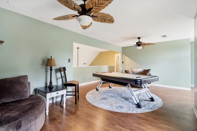 a living room with furniture and a table