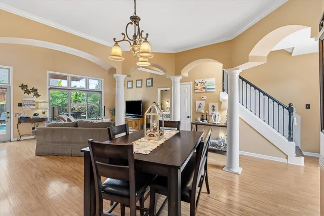 a view of a dining room with furniture window and wooden floor