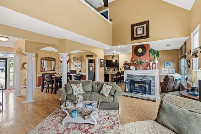 a living room with furniture and a fireplace