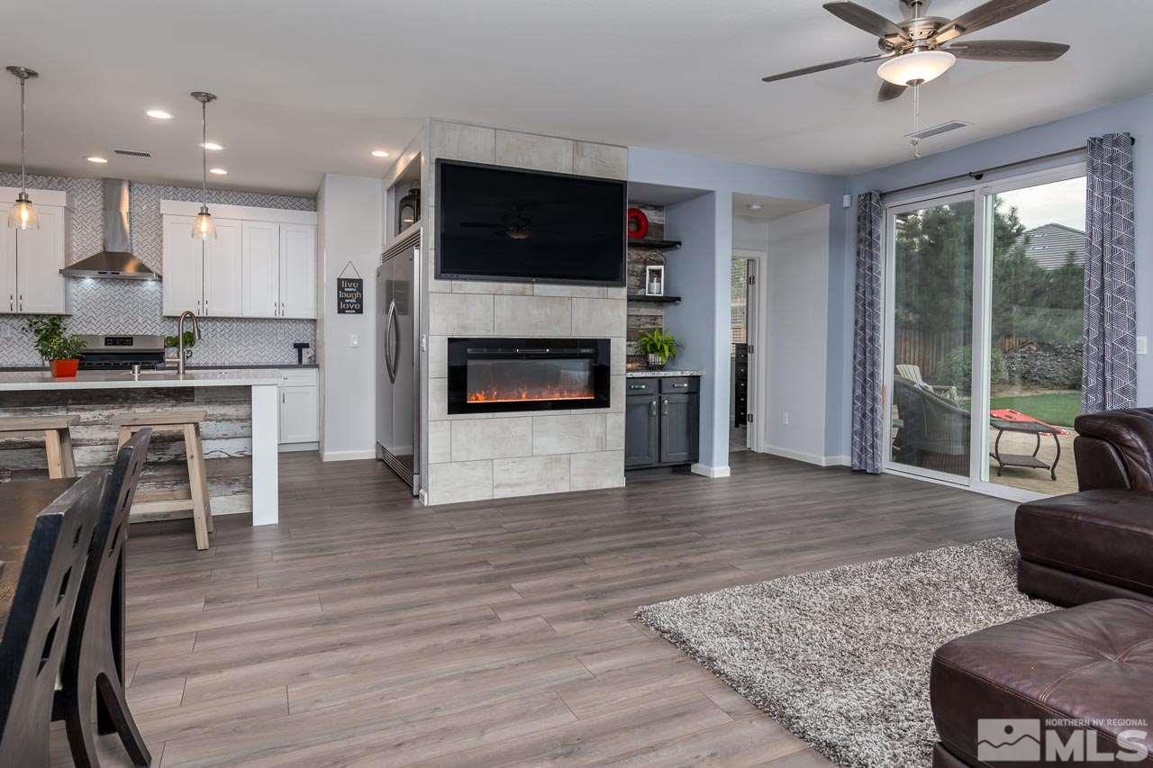 330 Teramo Drive Reno, NV 89521 - Photo 14 of 24 a living room with furniture wooden floor and a fireplace
