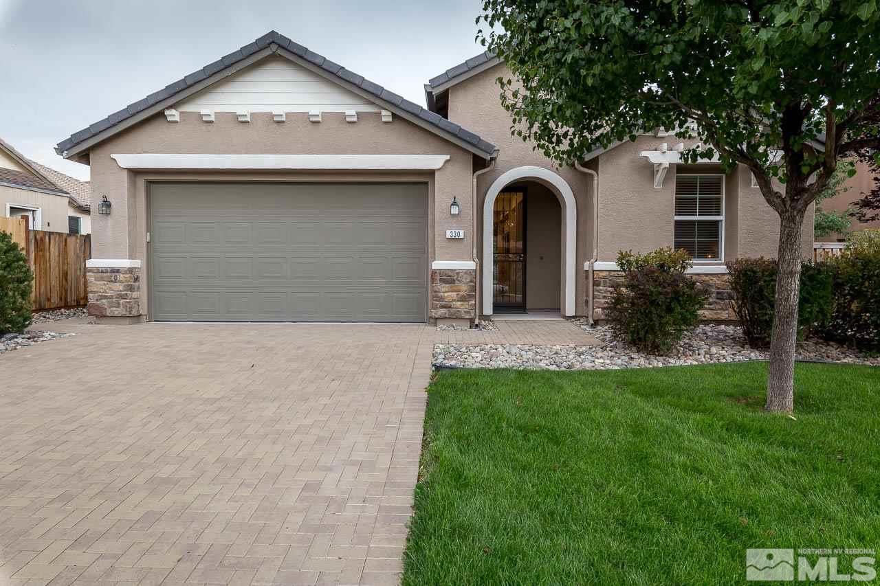 330 Teramo Drive Reno, NV 89521 - Photo 3 of 24 a front view of a house with garden