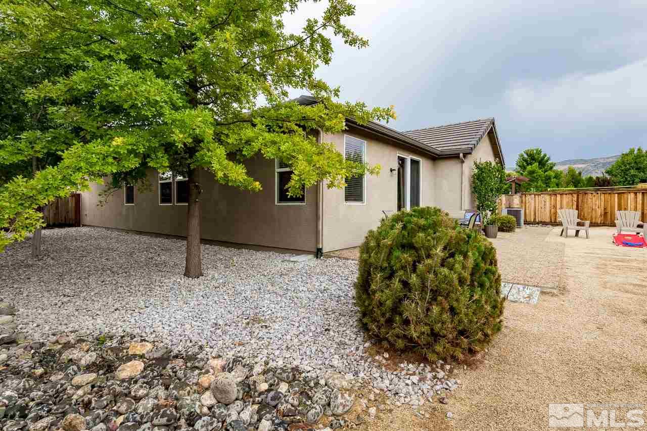 330 Teramo Drive Reno, NV 89521 - Photo 8 of 24 a house with trees in front of it