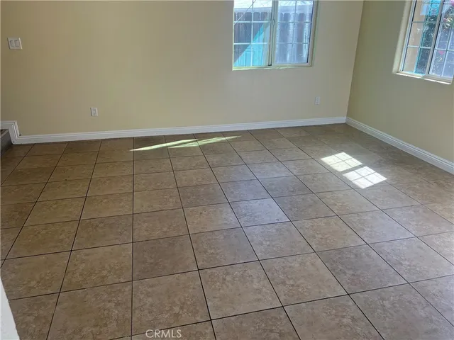 a view of an empty room and window in a room