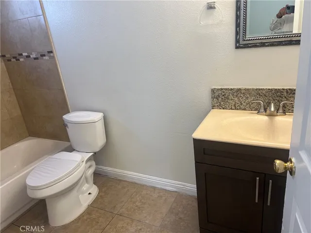a bathroom with a toilet and a sink