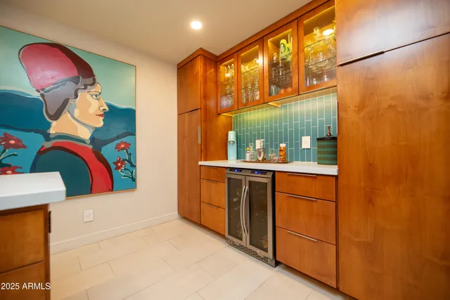 a spacious bedroom with a large bed and a rug