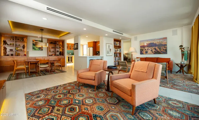 a kitchen with stainless steel appliances granite countertop a sink and a refrigerator