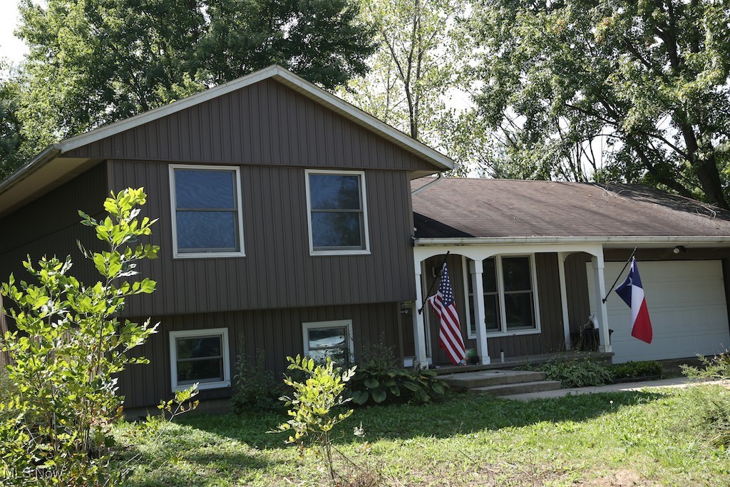 10054 Smith Road Litchfield, OH 44253 - Photo 1 of 9 View of front of house with a front yard
