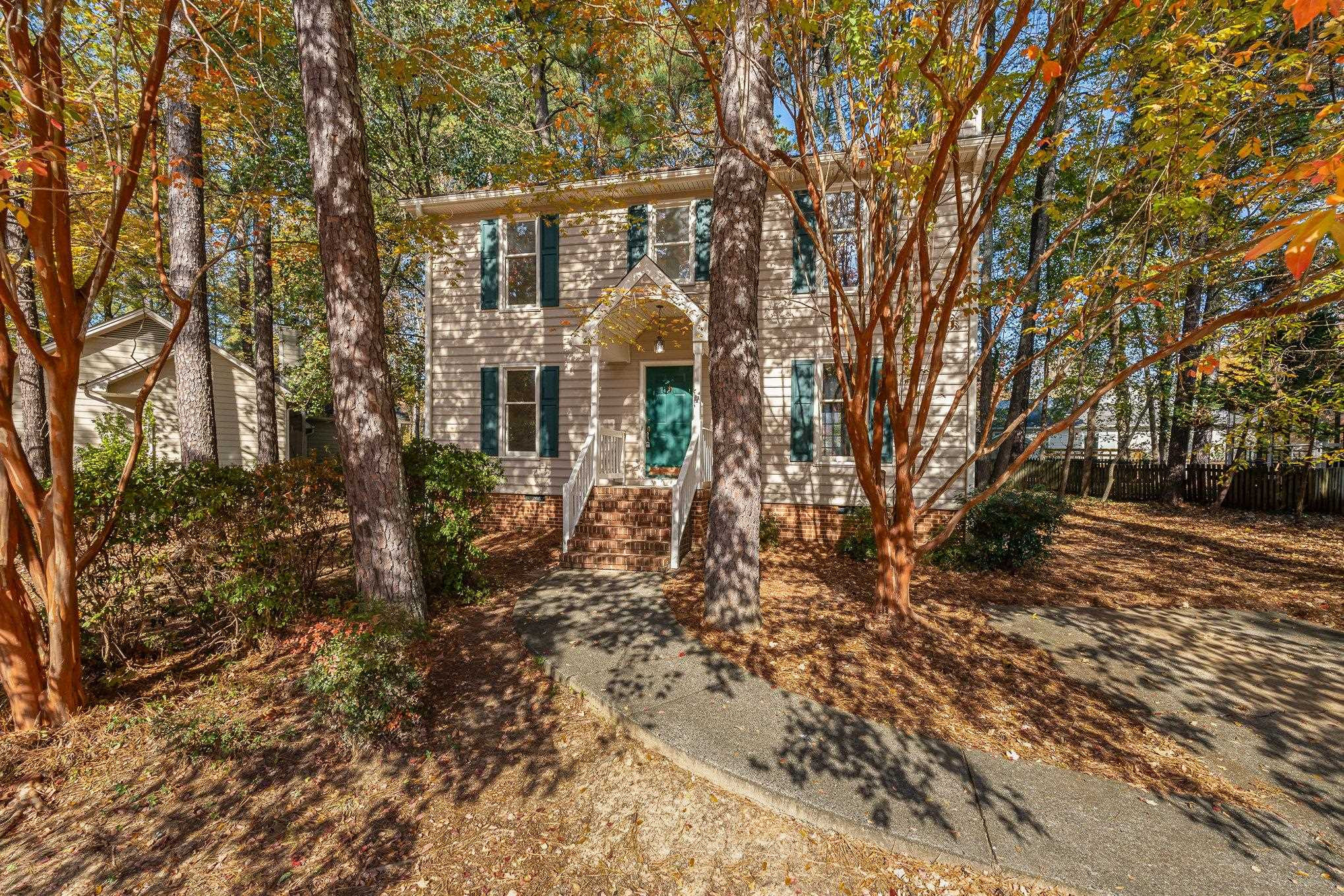 4110 Olde Coach Road Durham, NC 27707 - Photo 1 of 27 a front view of a house with a yard