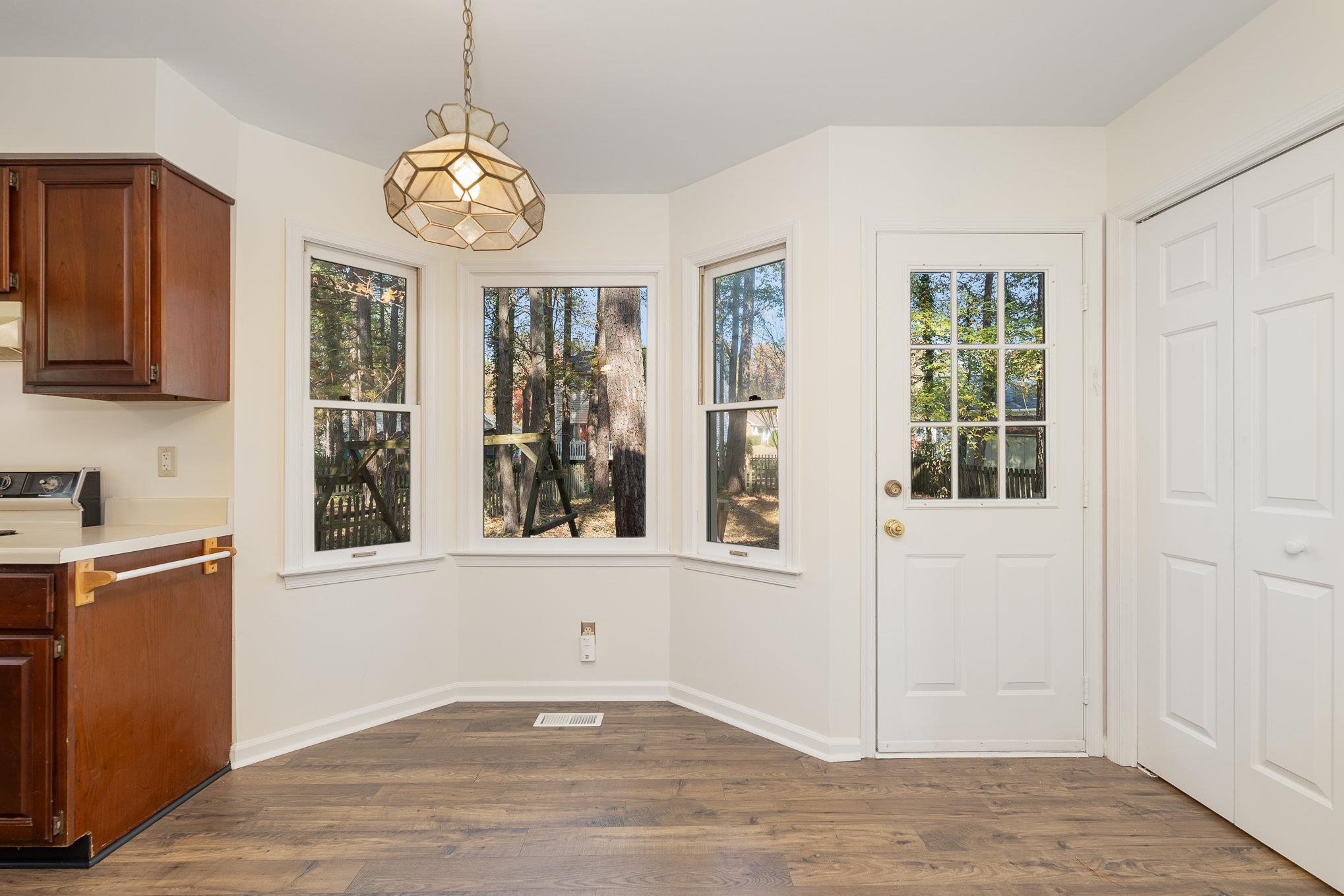 4110 Olde Coach Road Durham, NC 27707 - Photo 11 of 27 a view of an entryway with wooden floor and door