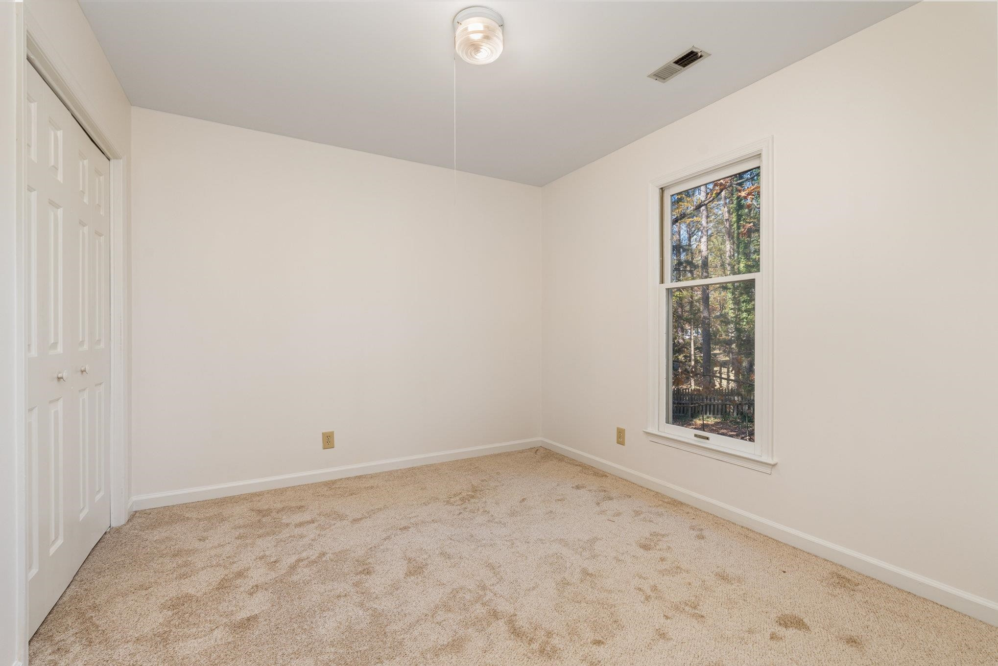 4110 Olde Coach Road Durham, NC 27707 - Photo 16 of 27 an empty room with a window