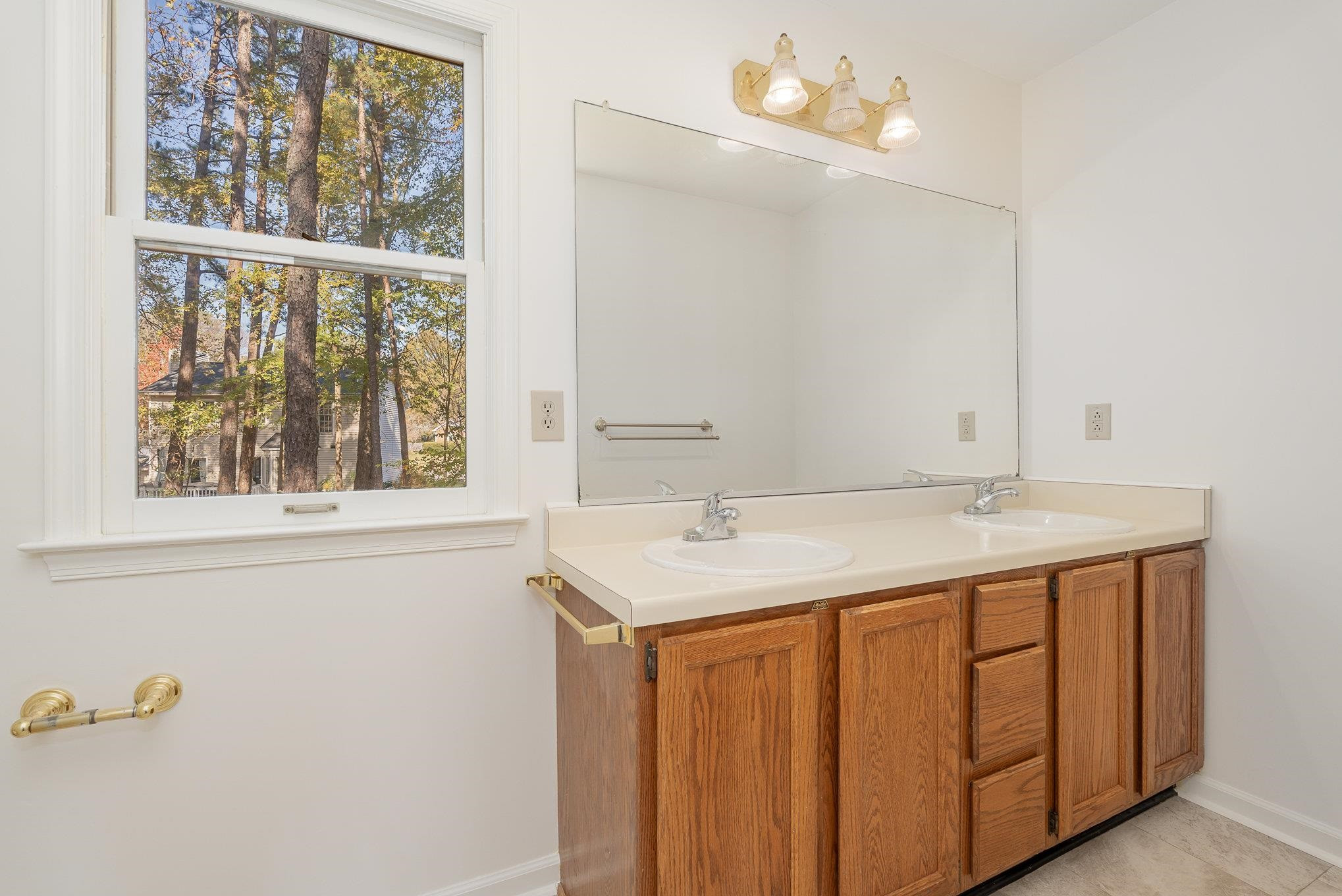 4110 Olde Coach Road Durham, NC 27707 - Photo 21 of 27 a bathroom with a sink vanity and a mirror