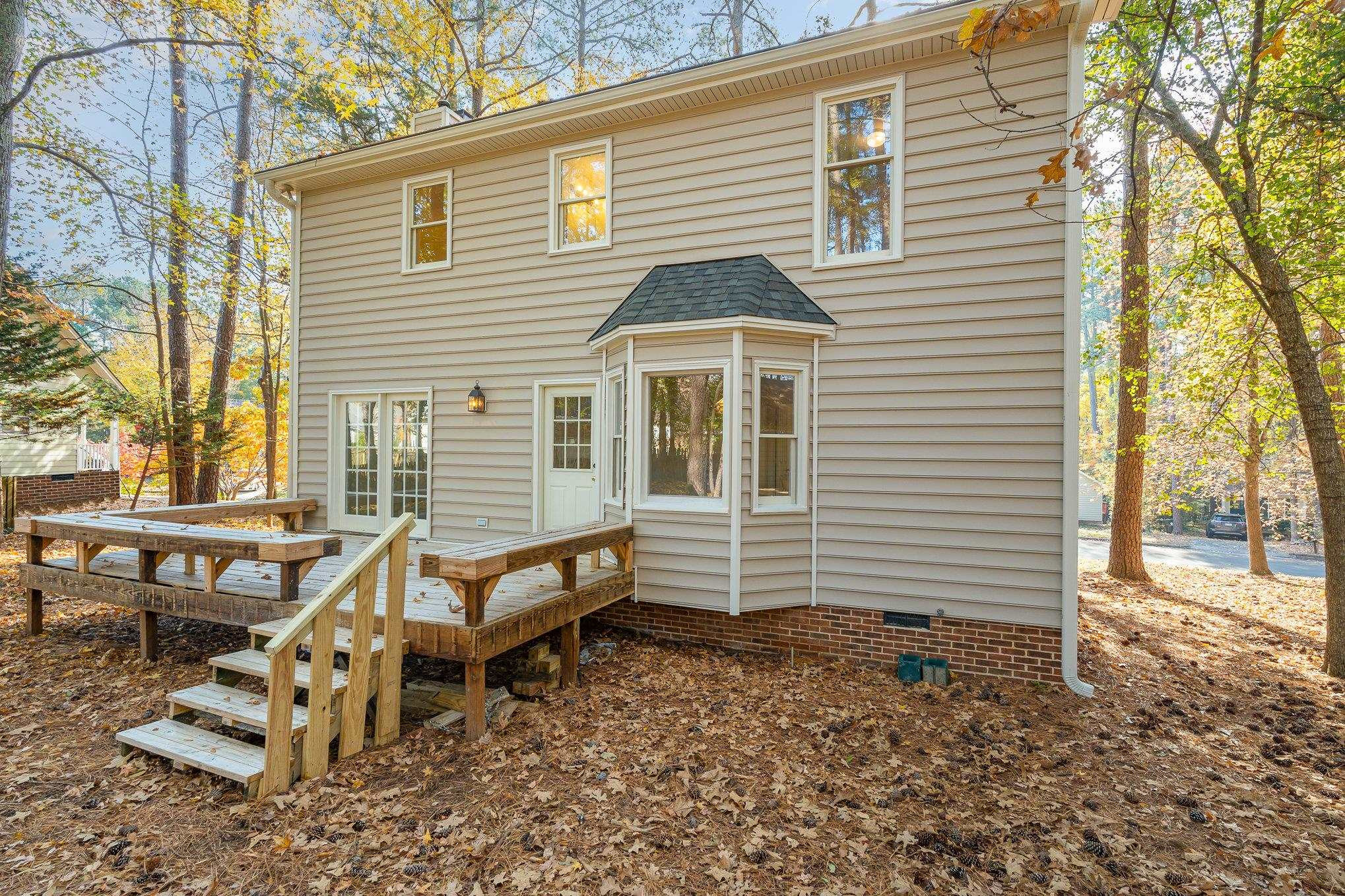 4110 Olde Coach Road Durham, NC 27707 - Photo 24 of 27 a view of a house with backyard and sitting area