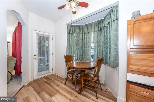a view of a room with furniture and a window