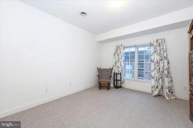 a view of livingroom with window and furniture