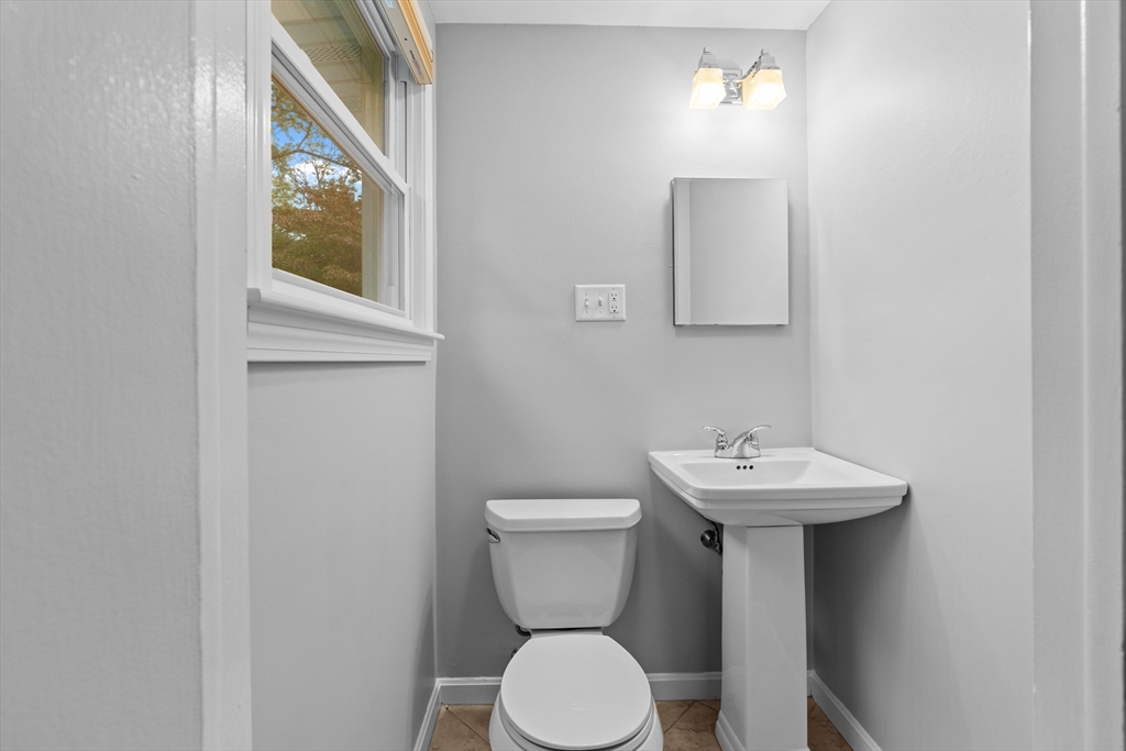 5 Janice Circle Framingham, MA 01701 - Photo 12 of 36 a bathroom with a toilet sink and mirror
