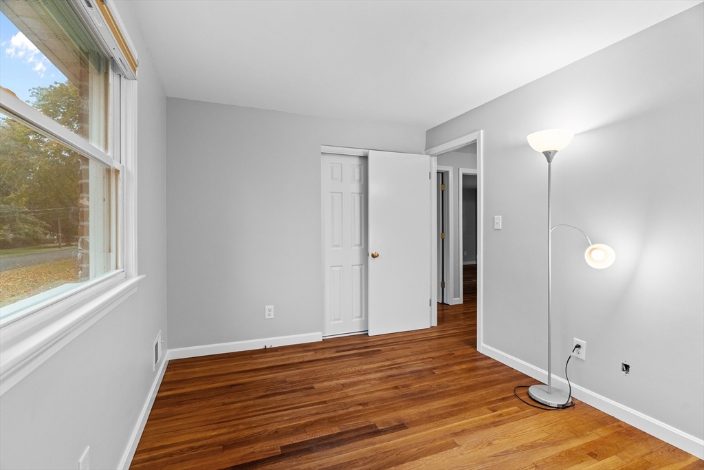 5 Janice Circle Framingham, MA 01701 - Photo 18 of 36 a view of empty room with wooden floor and fan