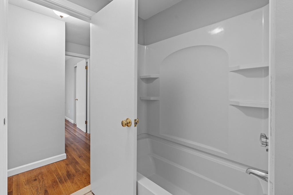5 Janice Circle Framingham, MA 01701 - Photo 20 of 36 a bathroom with a bathtub and shower