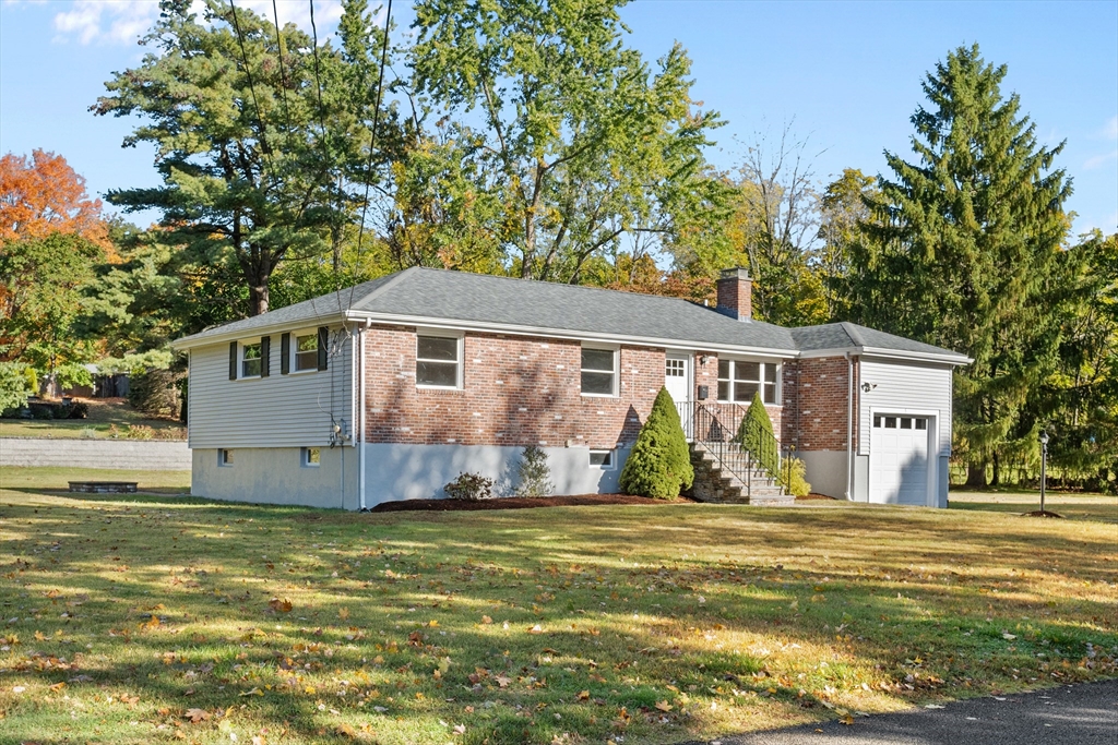 5 Janice Circle Framingham, MA 01701 - Photo 2 of 36 a front view of a house with a garden