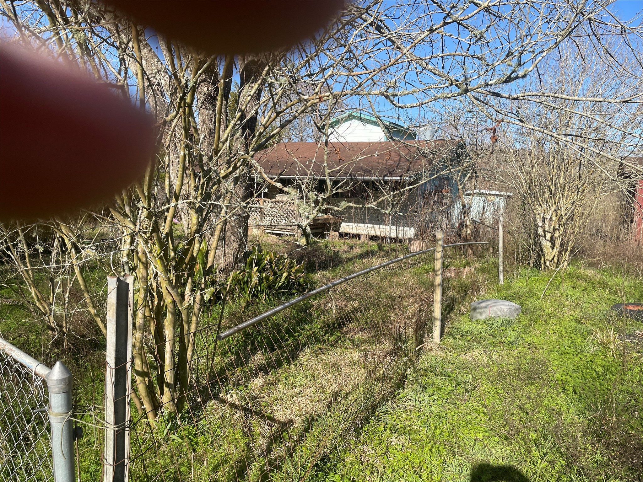 113 2901st Road Cleveland, TX 77327 - Photo 4 of 6 a backyard of a house with lots of green space