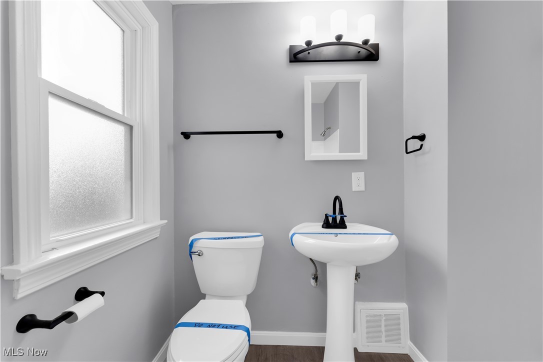 953 Whitby Road Cleveland Heights, OH 44112 - Photo 21 of 27 Half bath featuring toilet and dark wood finished floors