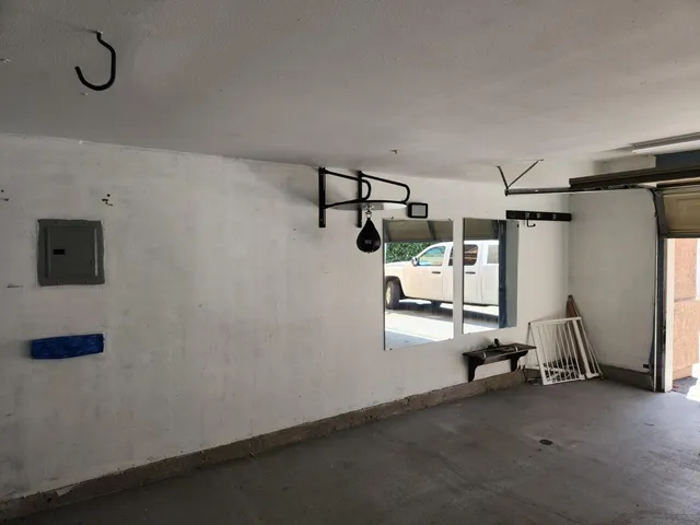 a view of storage and utility room with racks on the wall