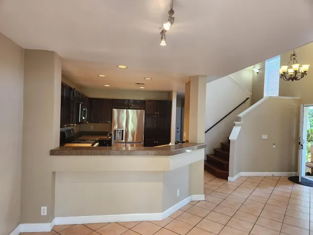 a kitchen with stainless steel appliances a stove and a microwave