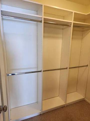 a view of an empty walk in closet